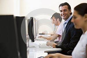 Four people in computer room