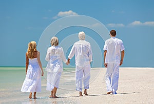 Four People, Two Seniors, Family Couples, Walking On Tropical Be