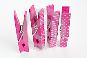 Four Pink Clothes Pins with Fun Patterns Standing Up Angled Front View