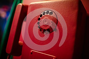 Four pink vintage telephone on a pink wall in pin-up style.