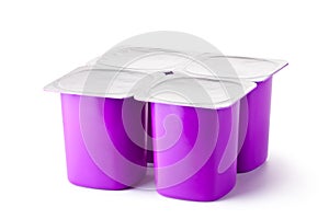 Four plastic containers for dairy products