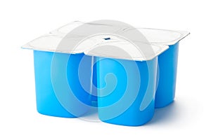 Four plastic containers for dairy products with foil lid