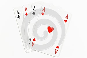 Four playing cards of Aces isolated on white background