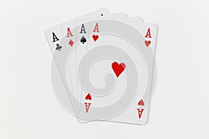 Four playing cards of Aces isolated on white background