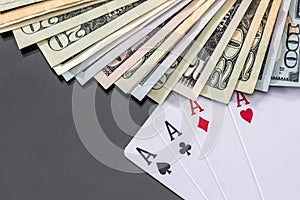 four poker aces above dollar.