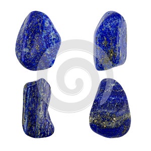 Four polished lapis lazuli stones isolated on white background