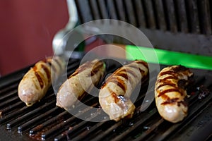 Four pork sausages white grilled delicious and quick snack for beer