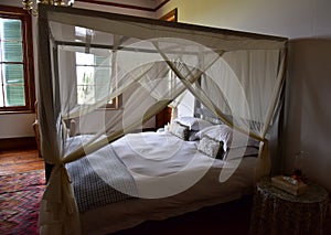 A four poster bed, promising a night of sound sleeping