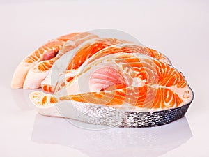 Four raw salmon steaks