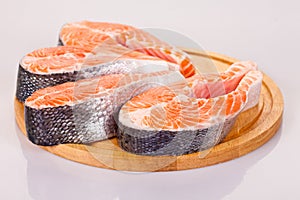 Four raw salmon steaks