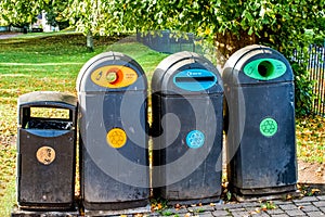 Four recycling bins in town park