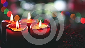 Four red candles for Advent. Christmas background.