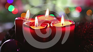 Four red candles for Advent. Christmas background.