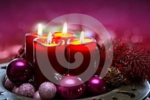 Four red candles for Advent. Christmas background.