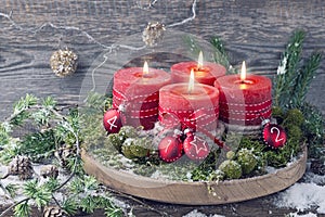 Four red christmas candle
