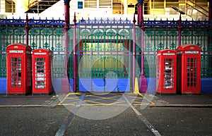 Four red english phone booths