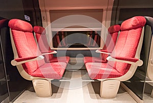 Four red train seats