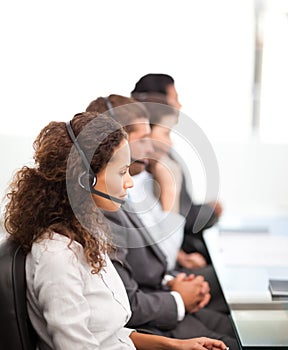 Four representatives on the phones with earpiece photo