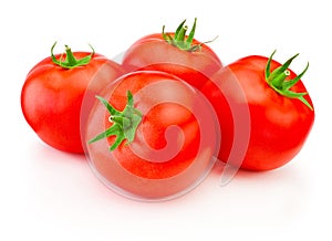 Four ripe red tomatoes isolated on white background