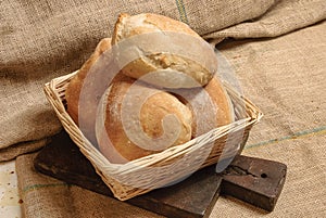 Four sandwiches in a wicker basket