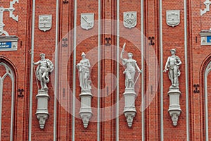 Four sculptures on Blackheads house wall in Riga.