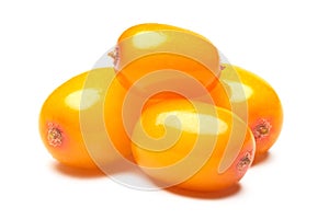 Four sea buckthorn berries, clipping paths photo