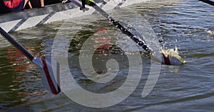 Four senior caucasian men and women rowing boat on a river