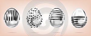 Four silver eggs on the pink background. Isolated objects for Easter. Stripes and dots ornate