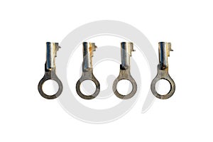 Four silver old padlock keys lying next to each other, isolated on a white background with a clipping path.