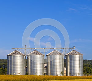 Four silver silos