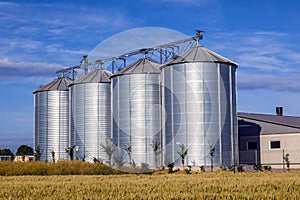Four silver silos