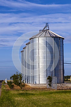 Four silver silos