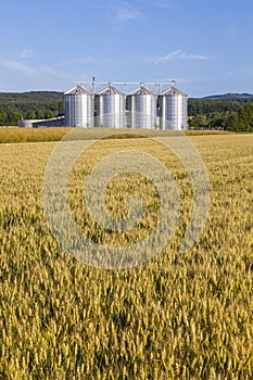 Four silver silos