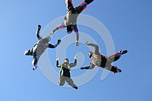 Four Skydivers building a star formation