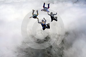 Four Skydivers building a star formation photo