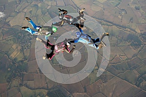 Four skydivers doing formations