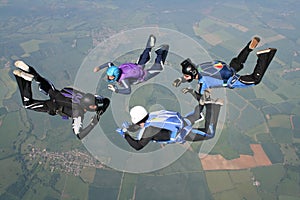 Four skydivers in freefall photo