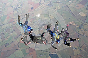 Four skydivers in freefall