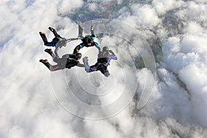 Four skydivers in freefall photo