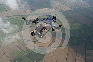 Four skydivers in freefall