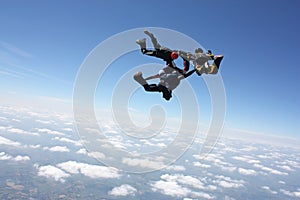 Four skydivers after the have exit an airplane photo