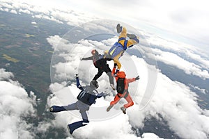 Four skydivers jump from a plane photo