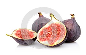 Four sliced figs isolated on white background