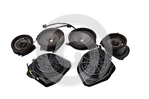 Four speakers of an acoustic system - an audio for playing music in a car interior on a white isolated background in a photo