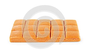 Four square pieces toffee caramel close-up isolated on white background
