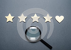 Four stars and a heart instead of the fifth and a magnifying glass. The concept of customer choice. Search. General recognition