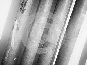 Black and white background and straight lines of steel pipes.