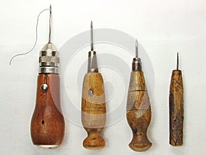 FOUR STITCHING AWLS