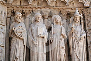 Four stone statues