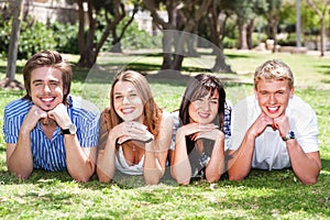 Four teens with hands on their chin